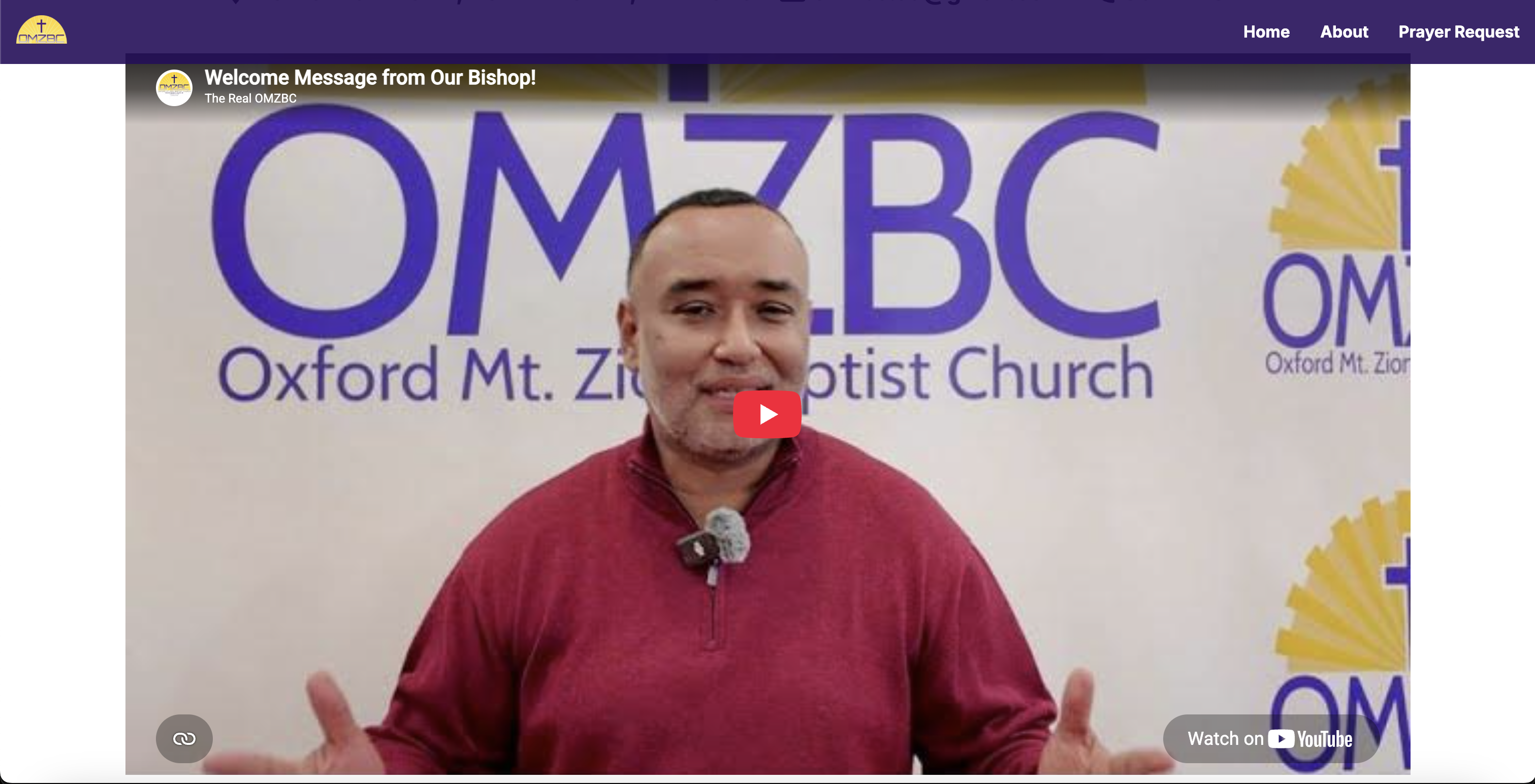 OMZBC homepage with an embedded YouTube welcome message from the Bishop